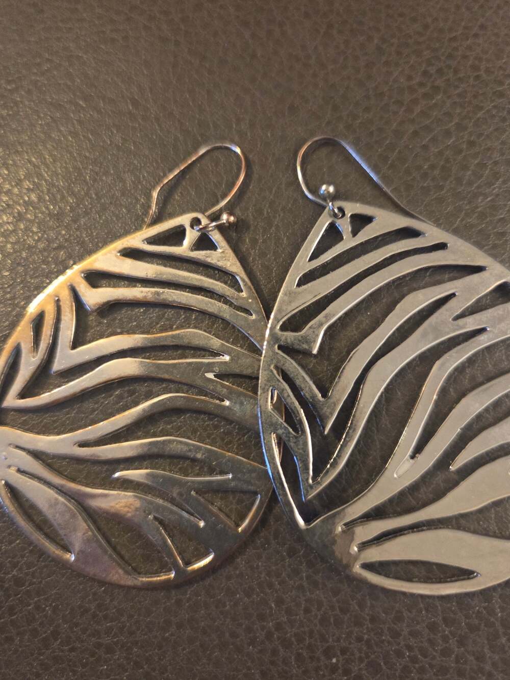 Vintage silver teardrop dangle earrings cutout zebrq stripes pattern. Y2K